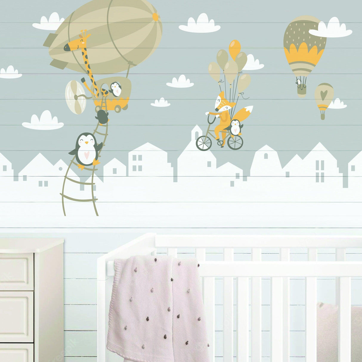 Penguins and fox wall stickers for kids featuring balloons in a nursery room decor.