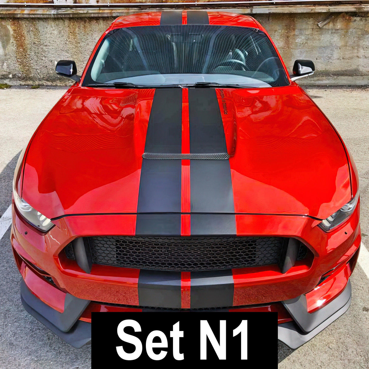 Racing stripes car stickers on a red sports car, showcasing sleek design and vibrant colors.