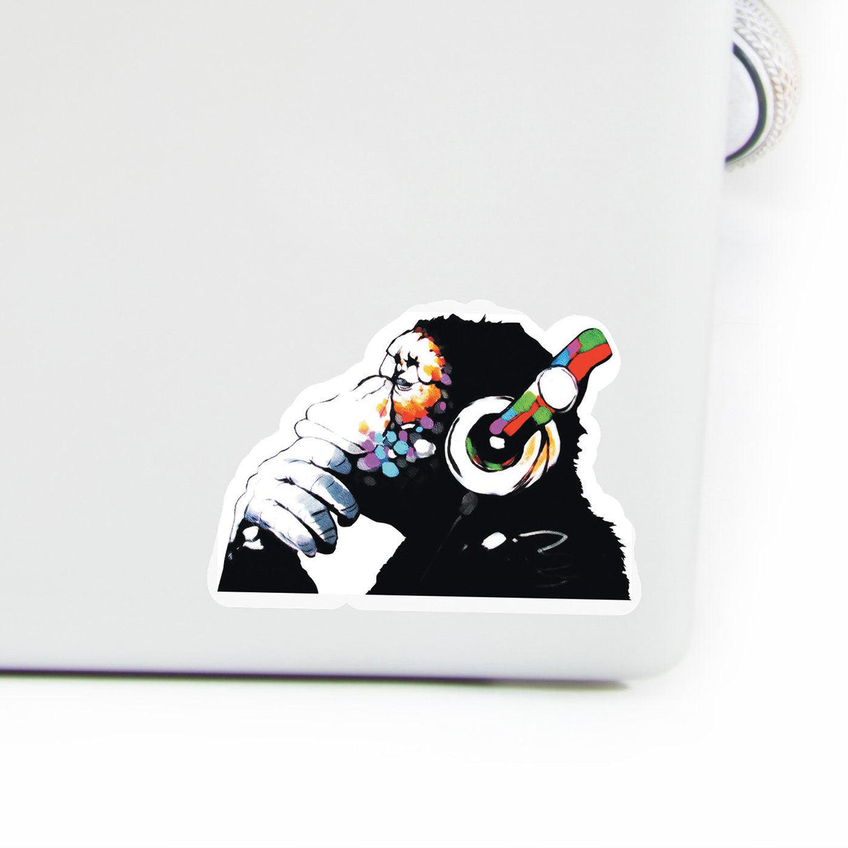 Colorful monkey wearing headphones decal for laptop, playful music design art sticker.
