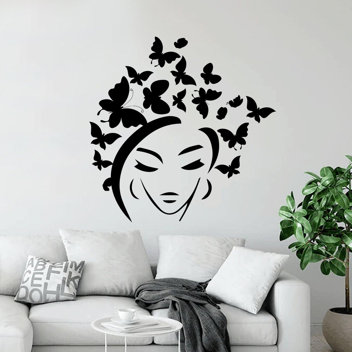 Butterfly wall sticker featuring a woman's face with butterflies as hair, perfect for home decor.