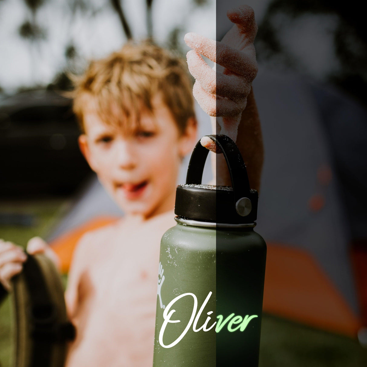A boy holding a green water bottle with the name 'Oliver' in glow-in-the-dark vinyl, enjoying outdoor activities.