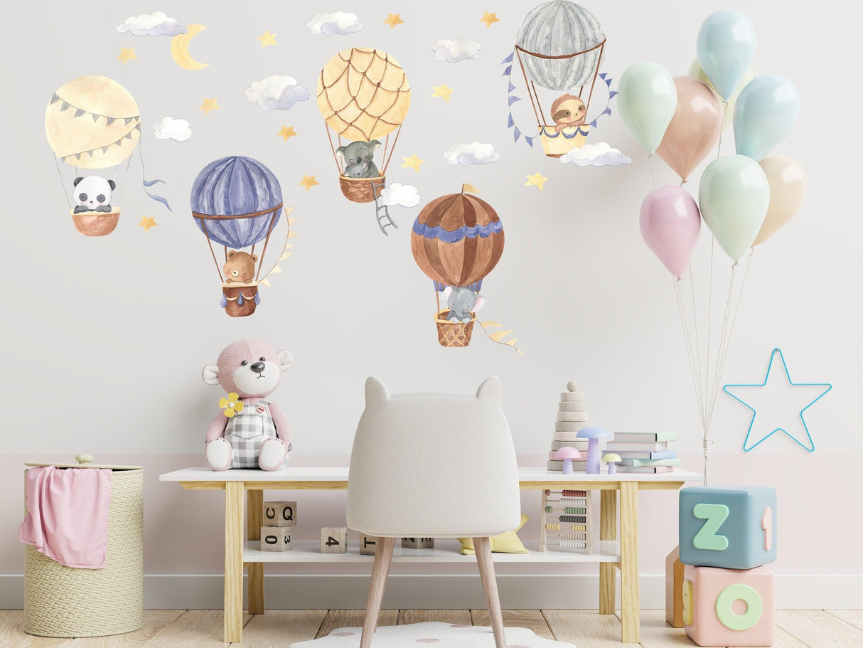 Colorful hot air balloon wall stickers featuring cute animals and clouds, perfect nursery decor for children's rooms.