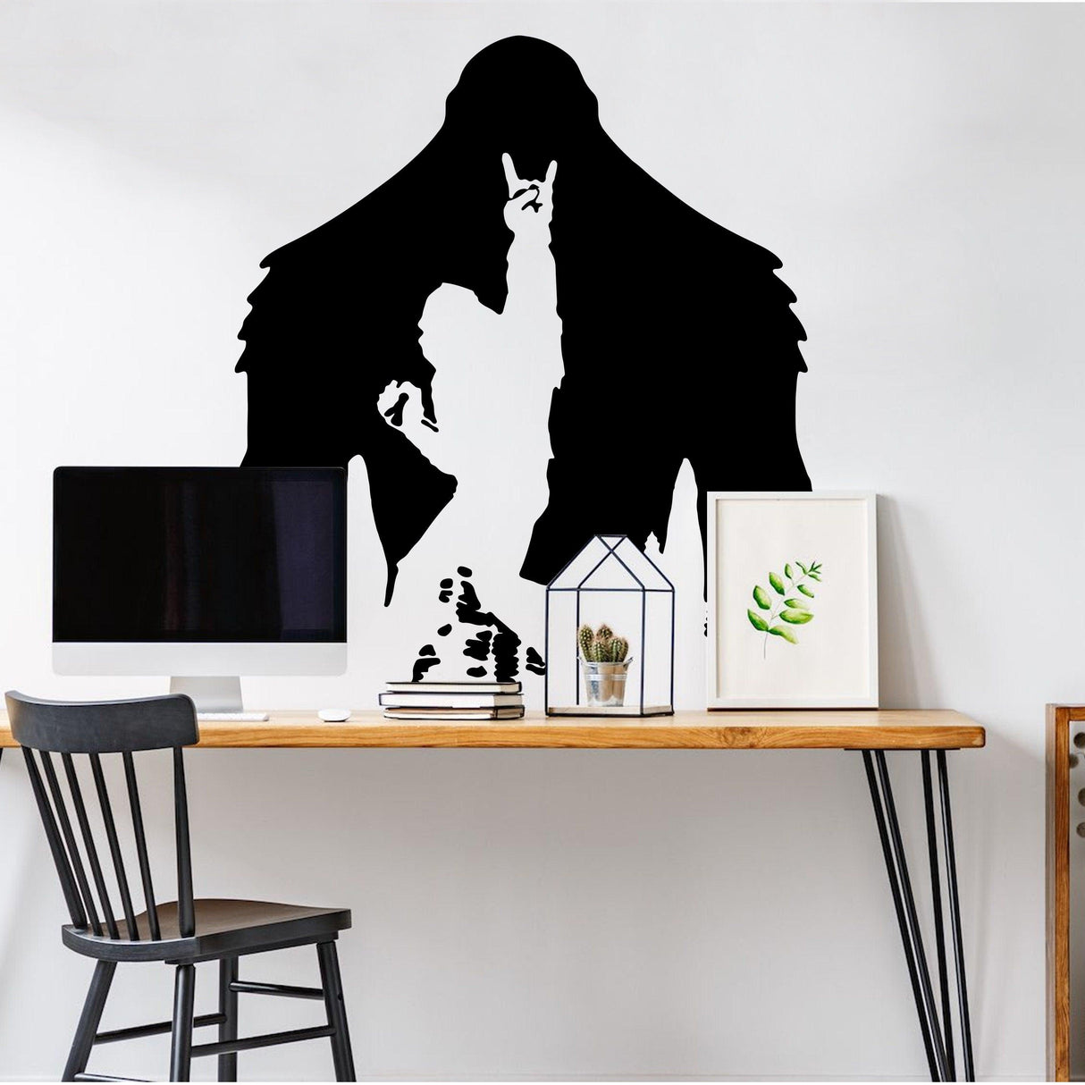 Black Yeti decal silhouette on a wall, featuring a figure and a humorous design, ideal for wall art.