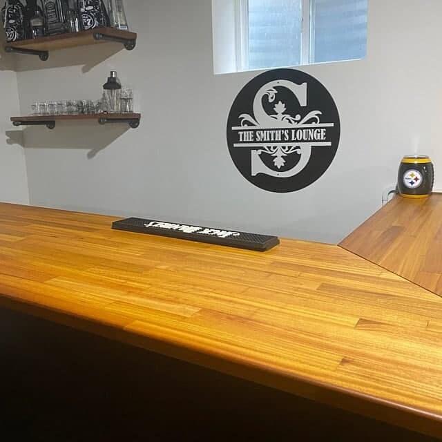 Custom wall decal design featuring 'The Smith's Lounge' in a stylish font, enhancing home bar decor.