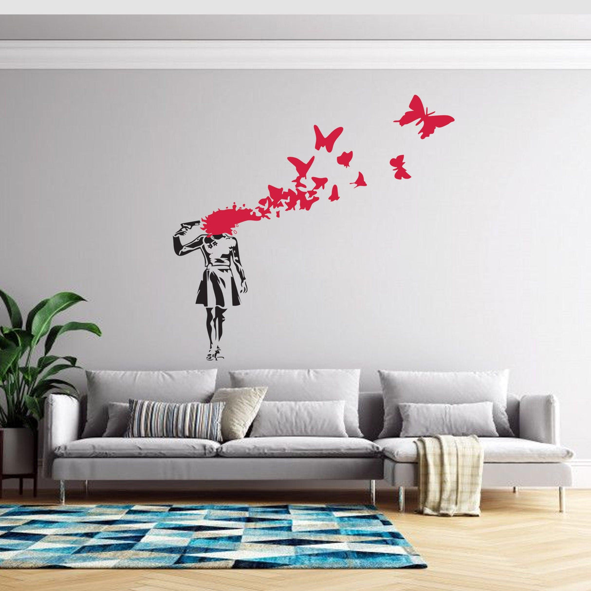 Banksy-inspired Suicide Girl wall decal with butterflies, adding edgy art to modern living room decor.