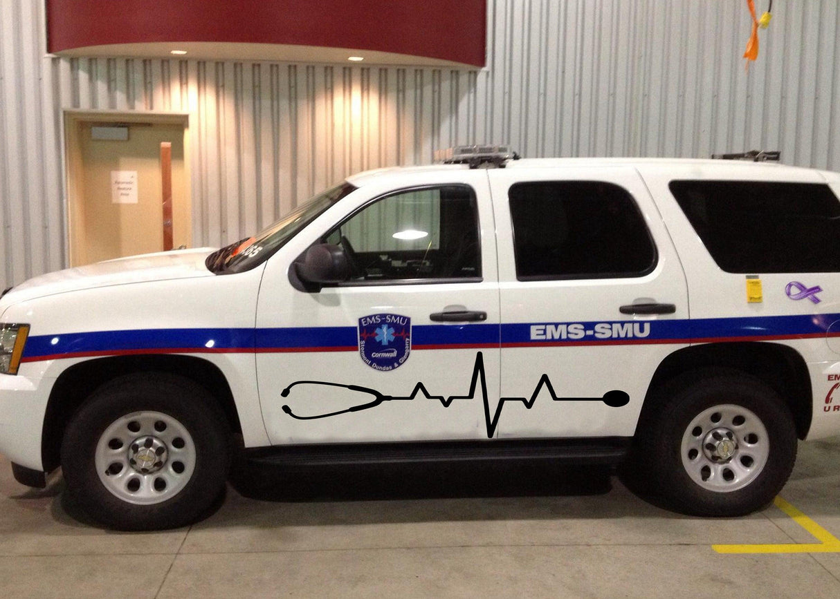 Emergency medical services SUV with EMS-SMU branding and heartbeat line decal on the side.