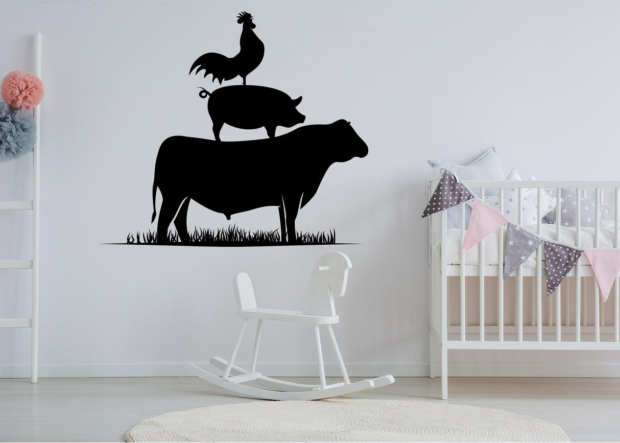 Farm animals wall sticker featuring a rooster, pig, and cow silhouette above a rocking chair in a nursery.