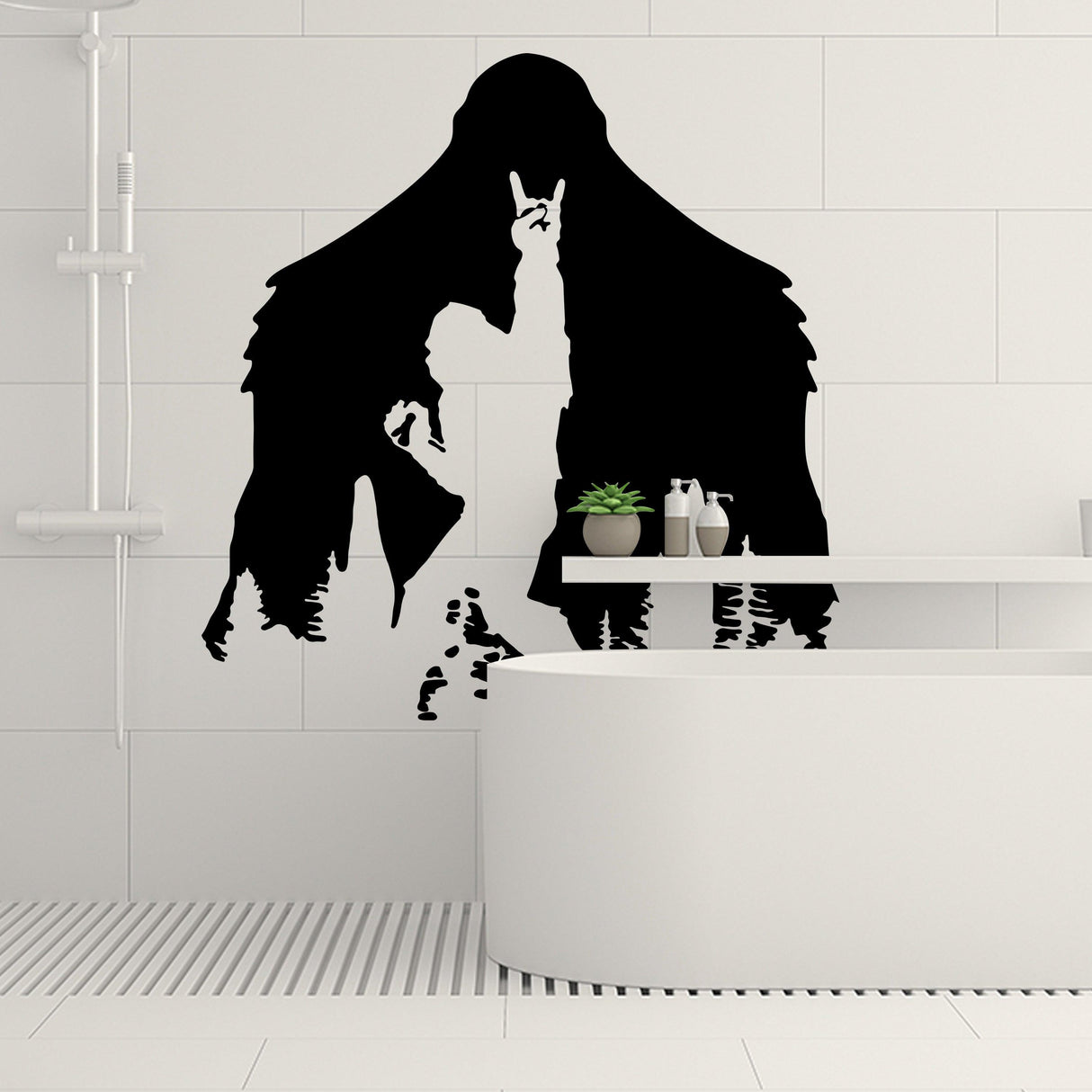 Sasquatch sticker decal on a bathroom wall featuring Bigfoot making a rock hand gesture in bold black design.