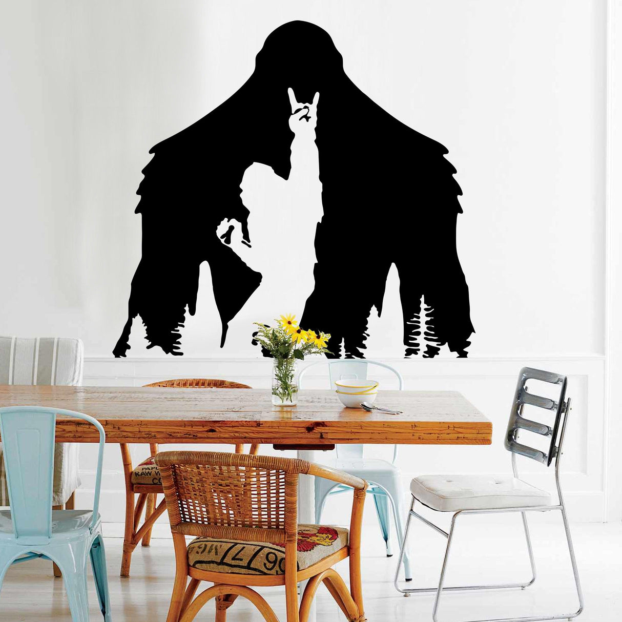 Black Yeti decal silhouette on wall, featuring a whimsical Sasquatch with a person, perfect for home decor.