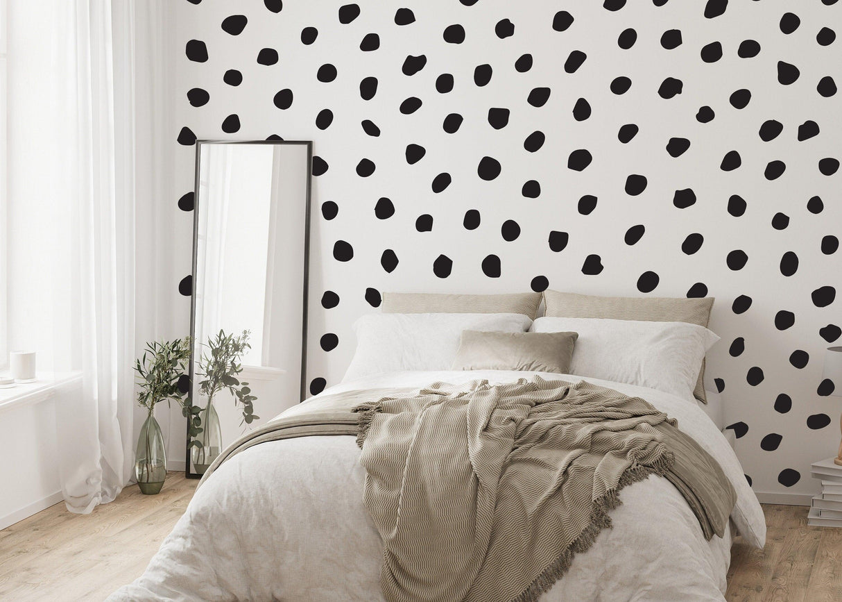 Modern bedroom featuring black polka dots wall decal, adding playful decor to the stylish space.