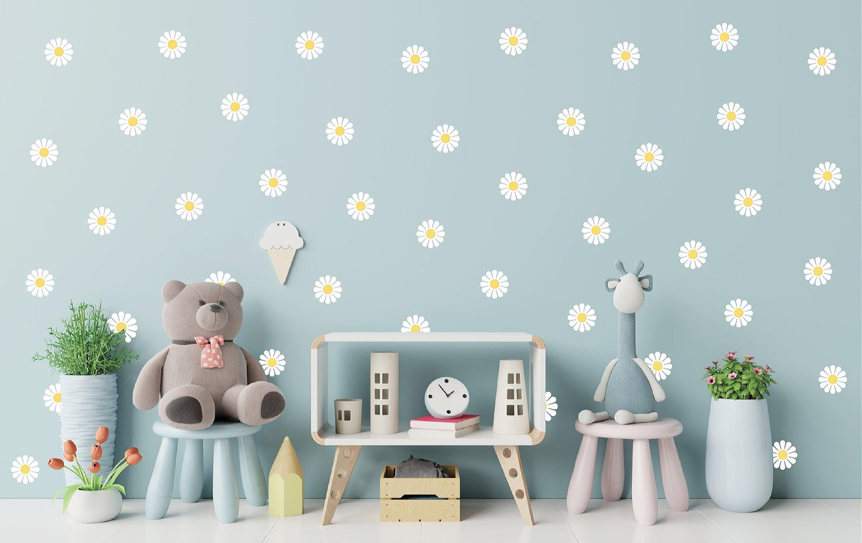 Living room with 24 white daisy wall stickers, teddy bear, and decor creating a cheerful atmosphere.