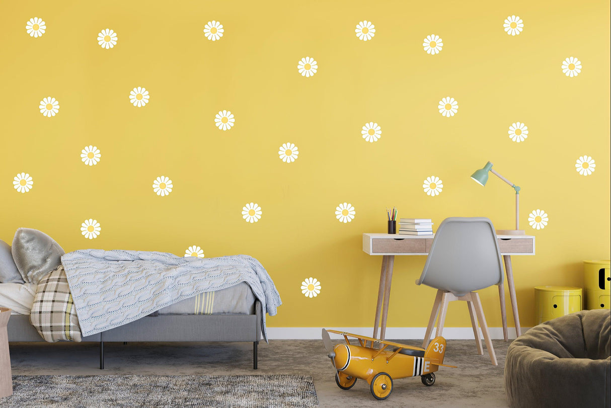 Yellow room with 24 white daisy flower wall stickers, featuring a bed, desk, and playful decor.