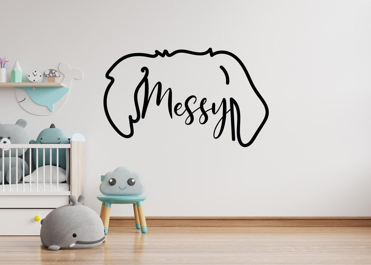Customized vinyl wall decal with the word 'Messy' and dog ear silhouette in a children's room.
