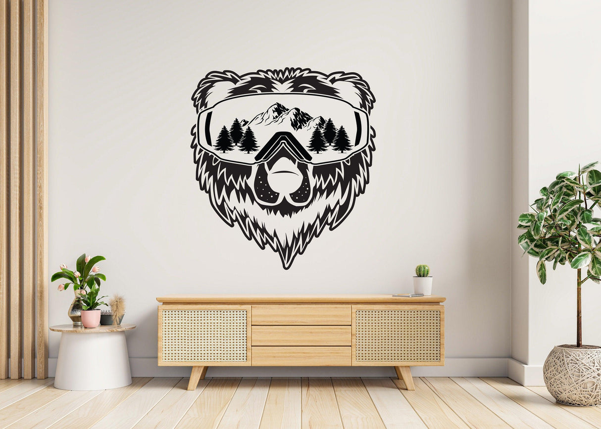 Wyoming wall sticker of a bear wearing ski goggles with mountains and trees, perfect for nature-themed decor.