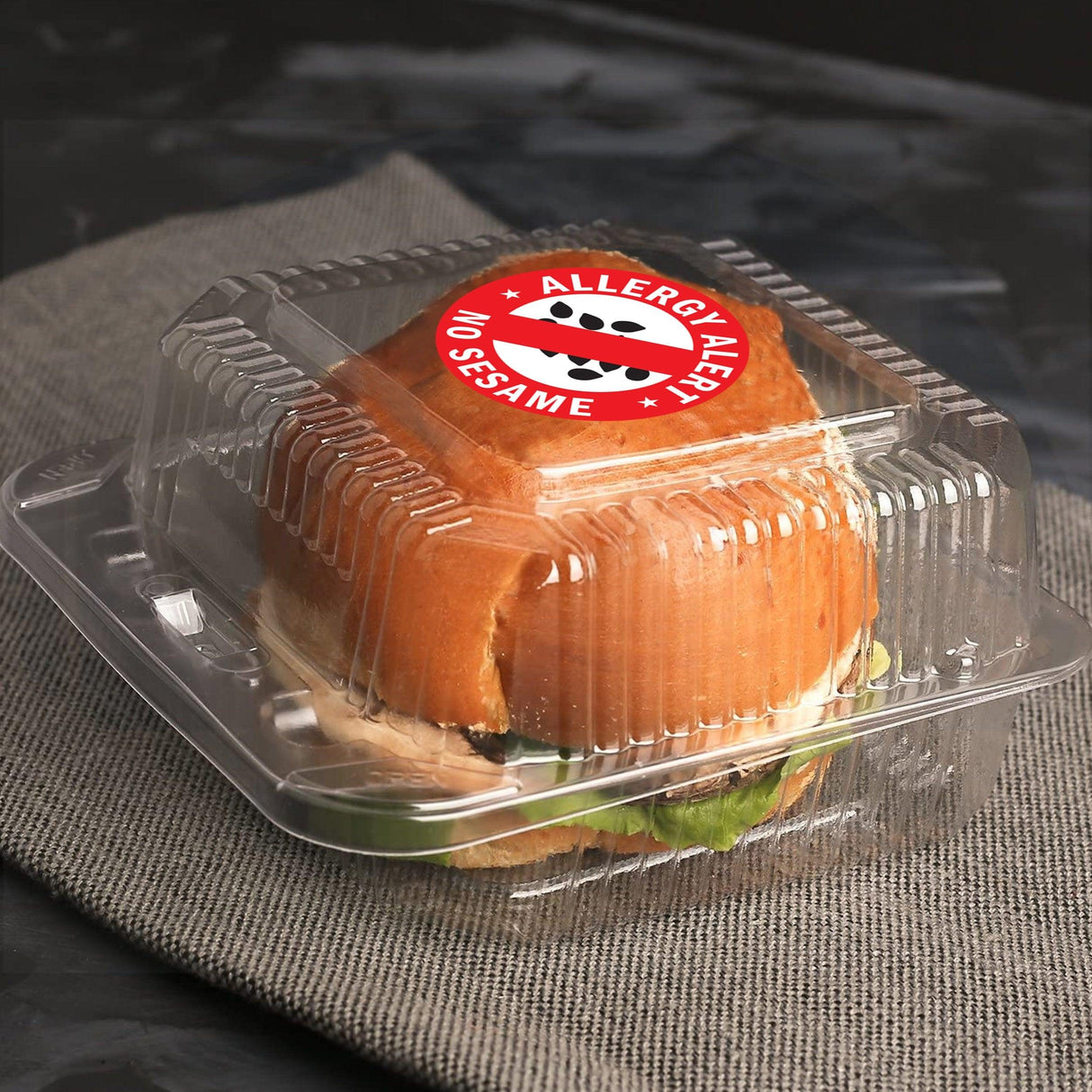 A secure sandwich package featuring a 'No Sesame' allergy alert sticker for safety awareness.