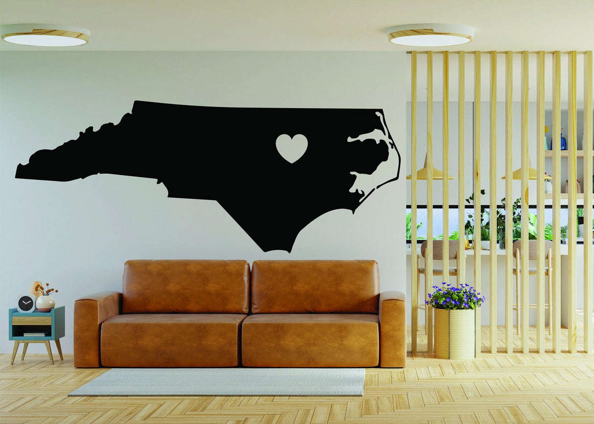 North Carolina wall decal featuring a heart symbol, showcased in a modern living room setting.