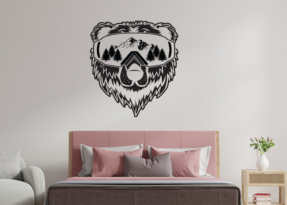 Vinyl wall decal of a bear wearing ski goggles with mountains, perfect for rustic decor.
