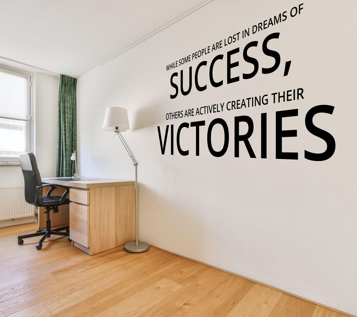 Inspirational wall art decal in a home office featuring motivational quotes about success and victories.