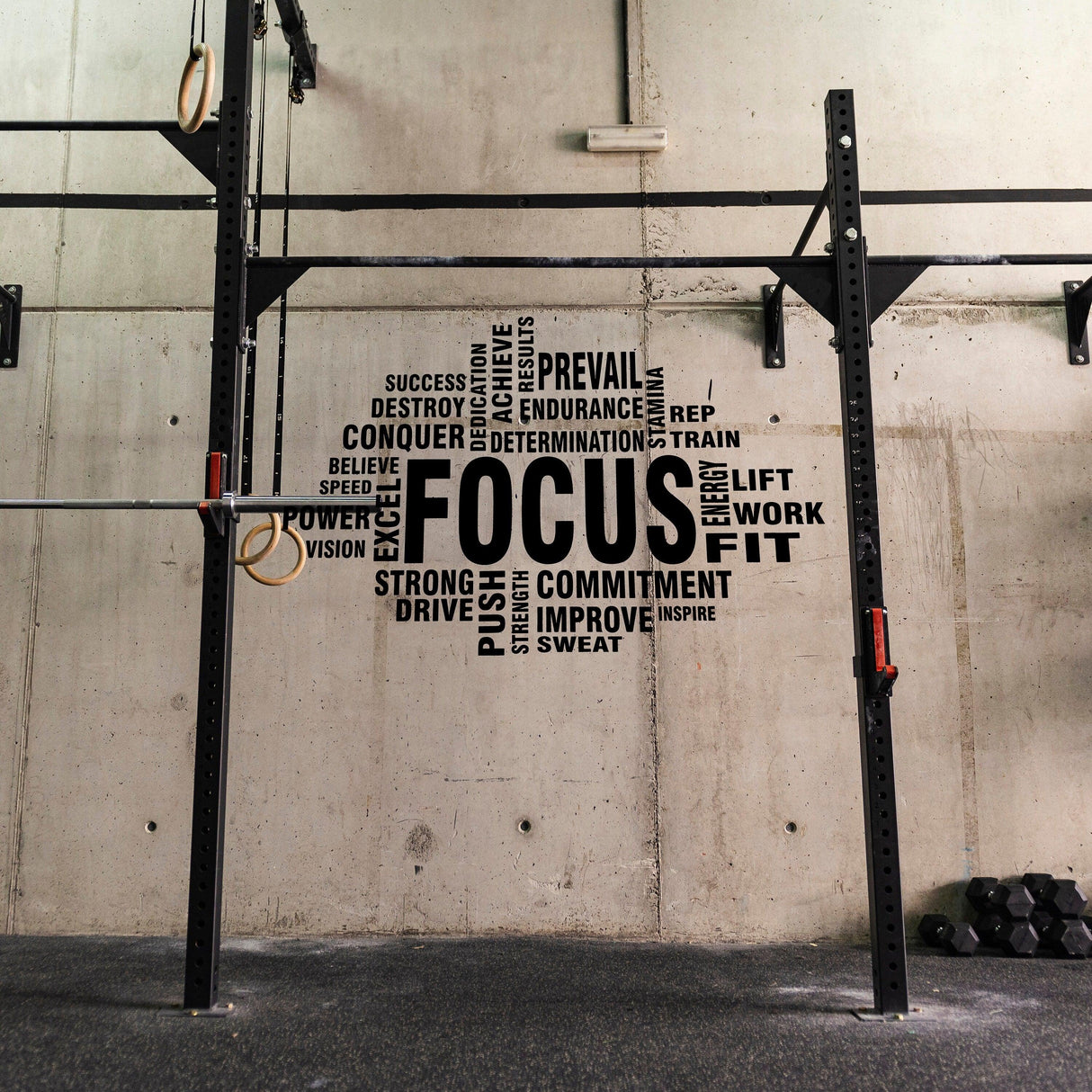 Motivational wall decal featuring the word 'FOCUS' and inspiring fitness terms for gym decor.