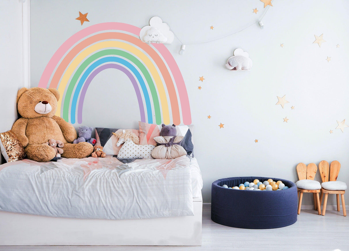 Charming Boho Style Rainbow Wall Sticker in a cozy nursery with stuffed animals and playful decor.