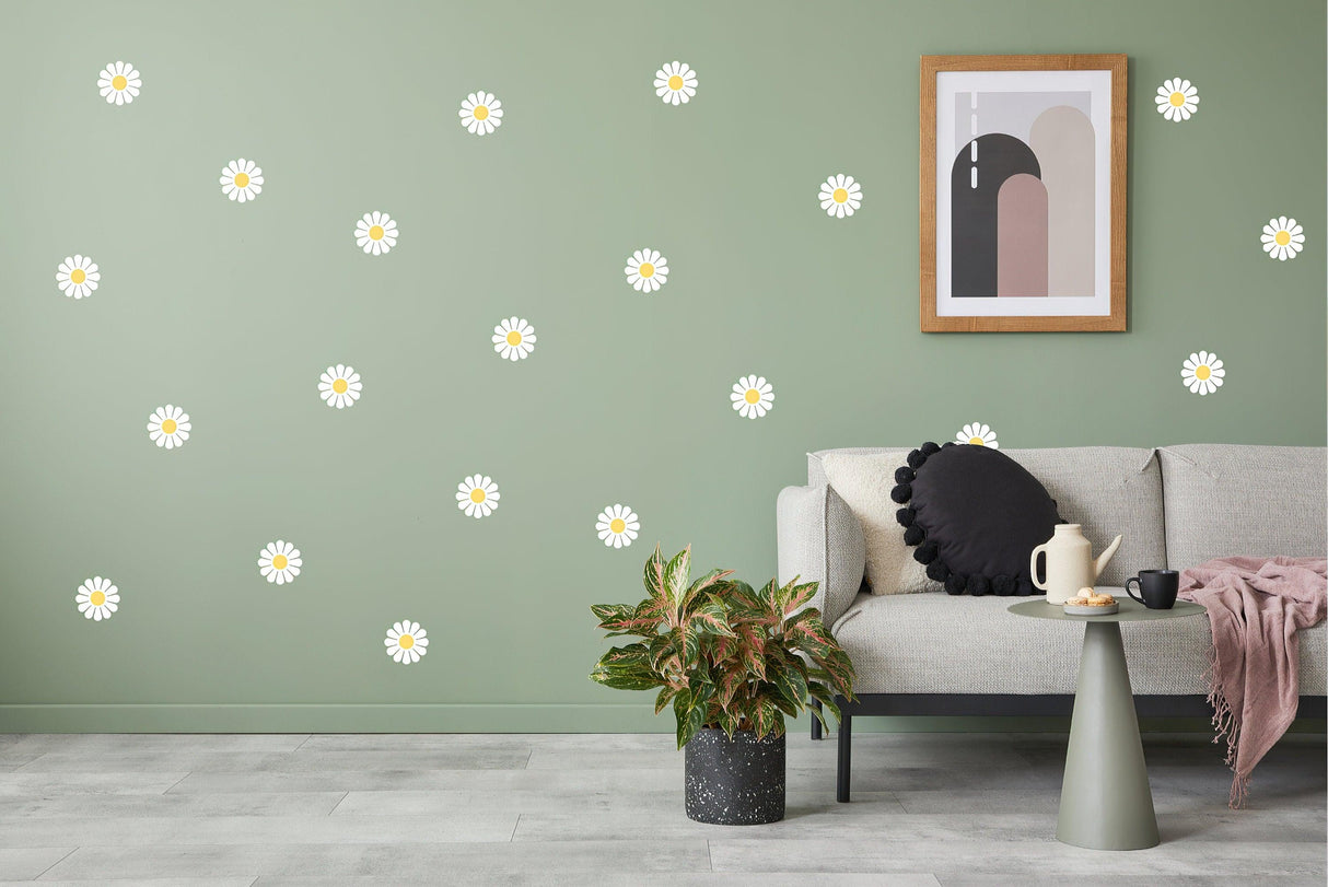 Whimsical daisy flower wall decals adorning a green wall in a stylish kids' room, featuring modern decor.
