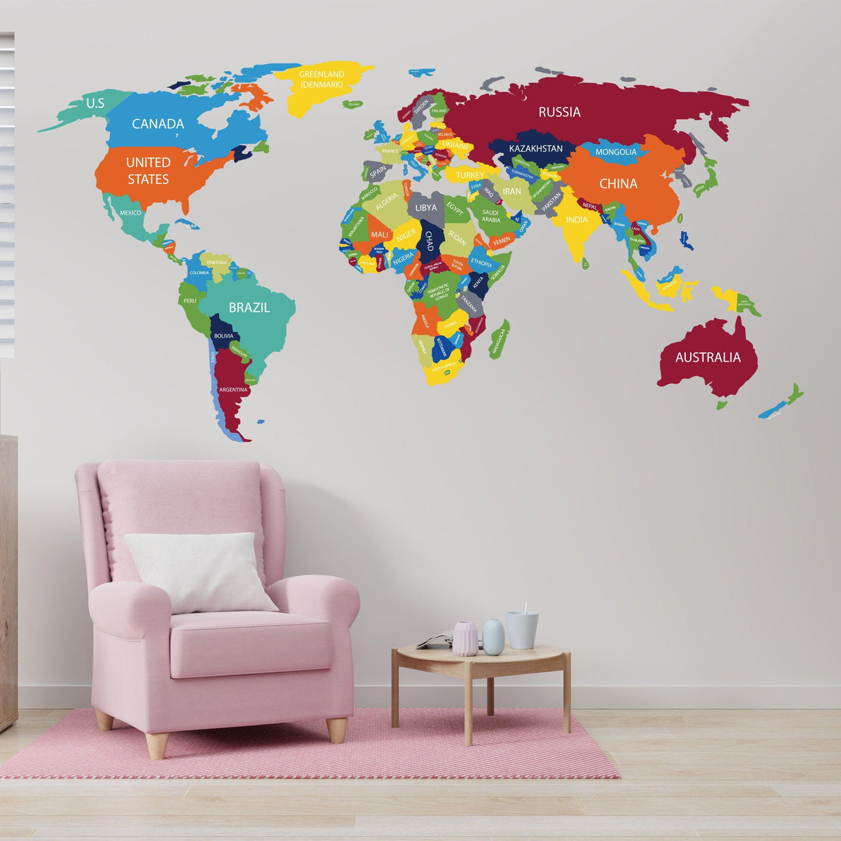 Colorful world map vinyl decal on wall, featuring country names, perfect for home decor and travel inspiration.