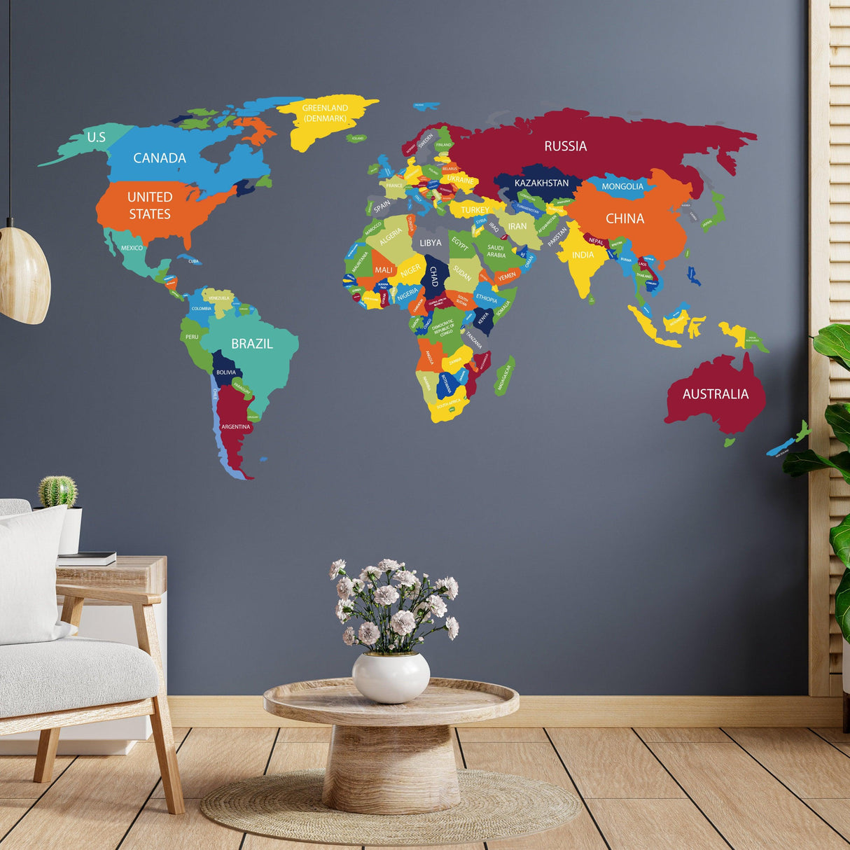 Colorful world map vinyl wall decal adding a global traveler theme to modern living space with country names.