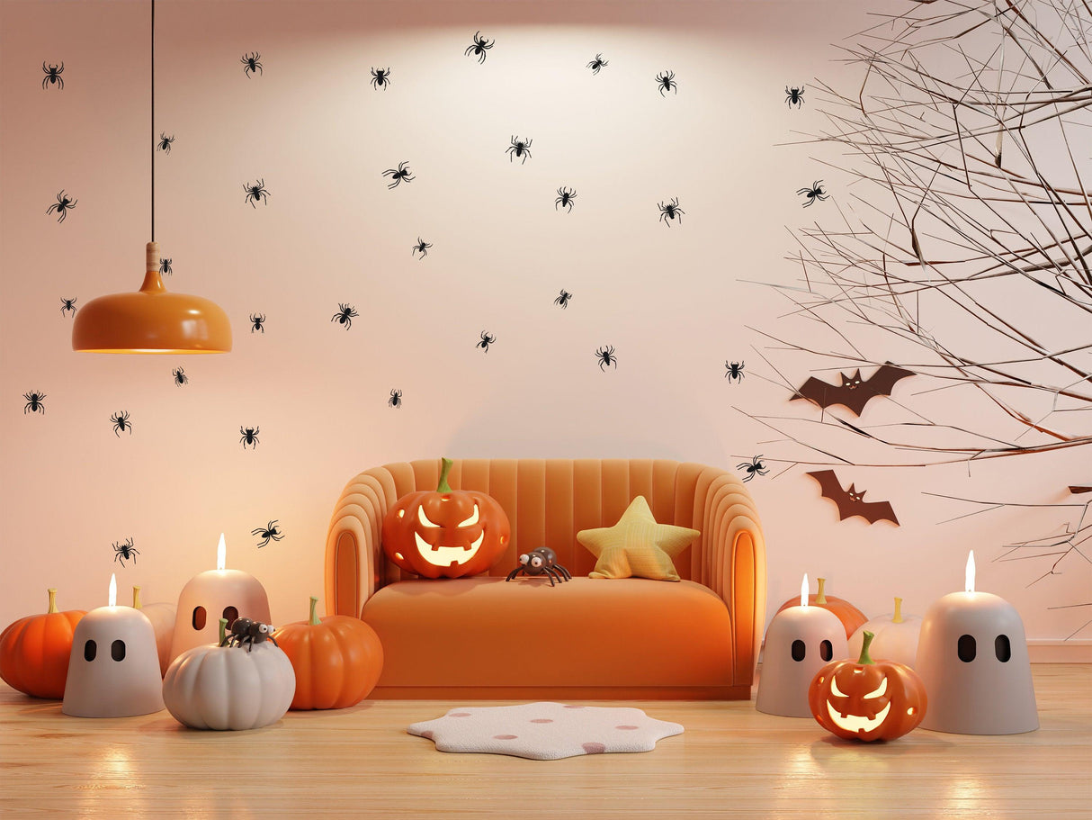 Halloween-themed living room with spider wall decals, pumpkins, ghost candles, and bats for spooky decor.