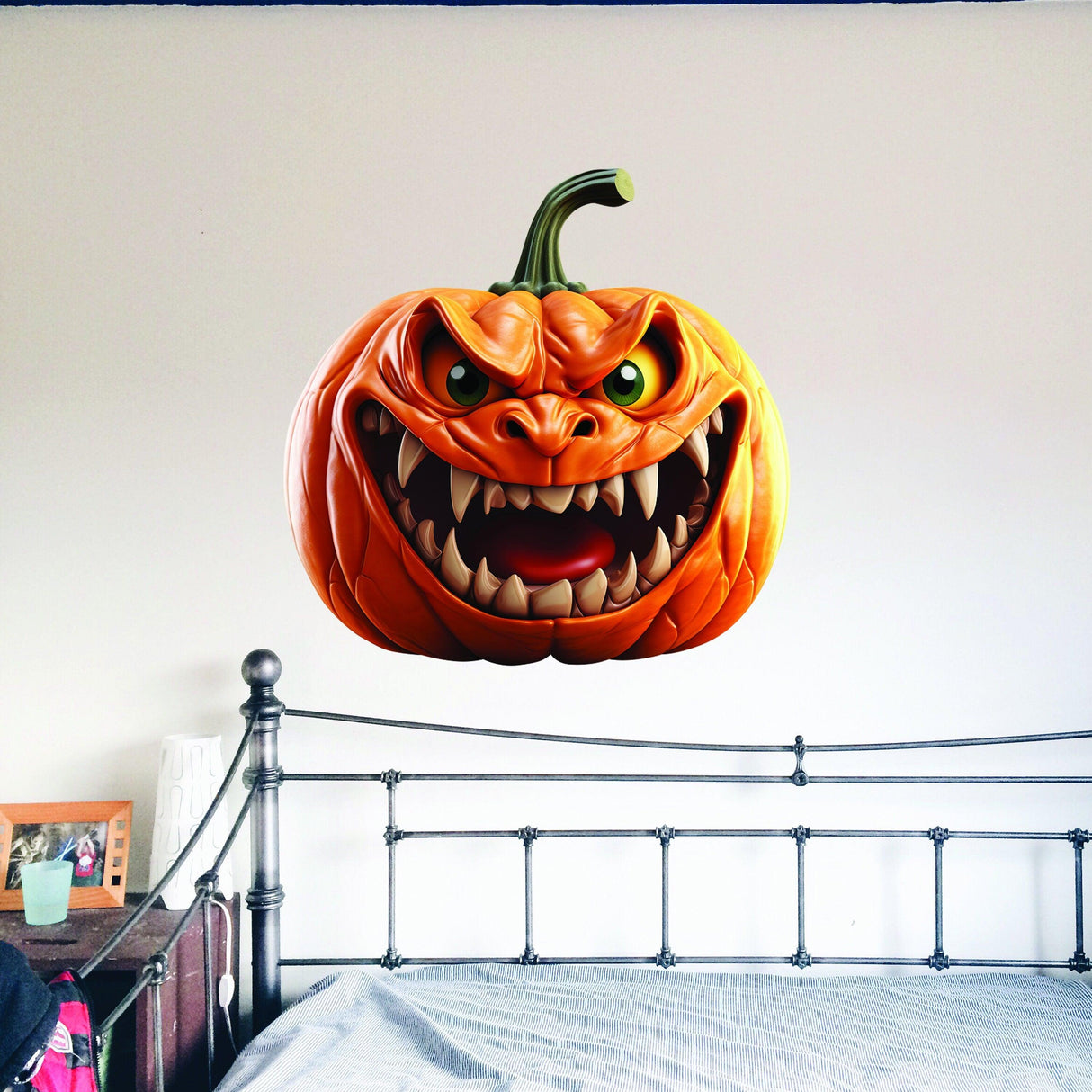 3D Evil Laughing Pumpkin vinyl wall decal on a bedroom wall, perfect for Halloween decoration.