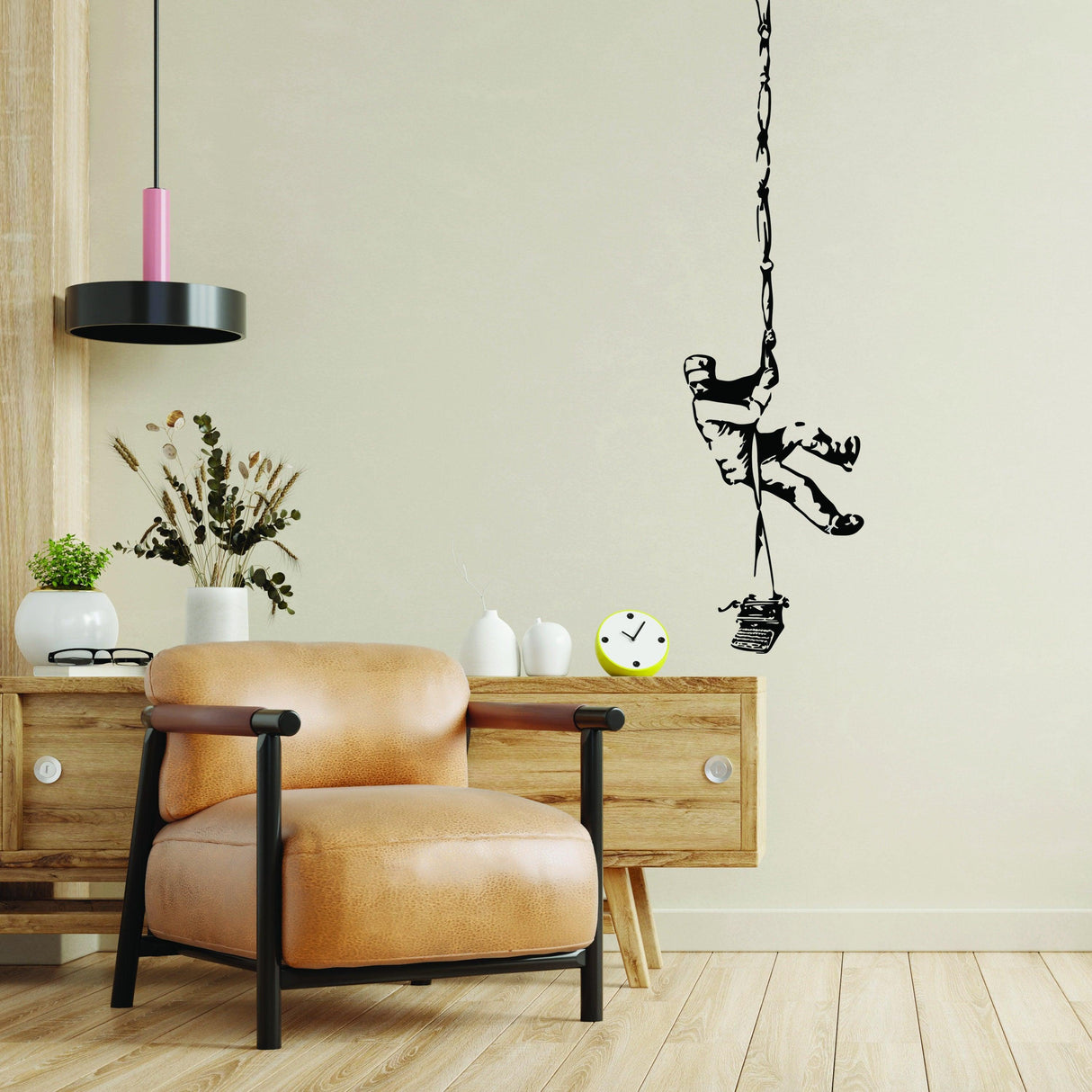 Banksy Prisoner Escape Wall Decal in modern living room, featuring a prisoner climbing with a rope against a beige wall.