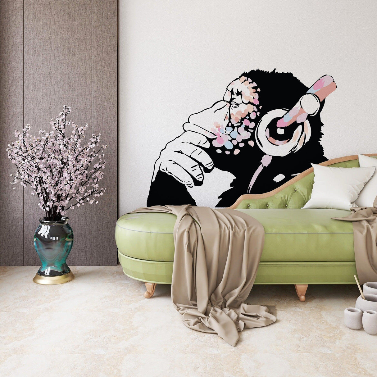Banksy-inspired pink thinking monkey decal on wall above green sofa, perfect for boho girls' room decor.