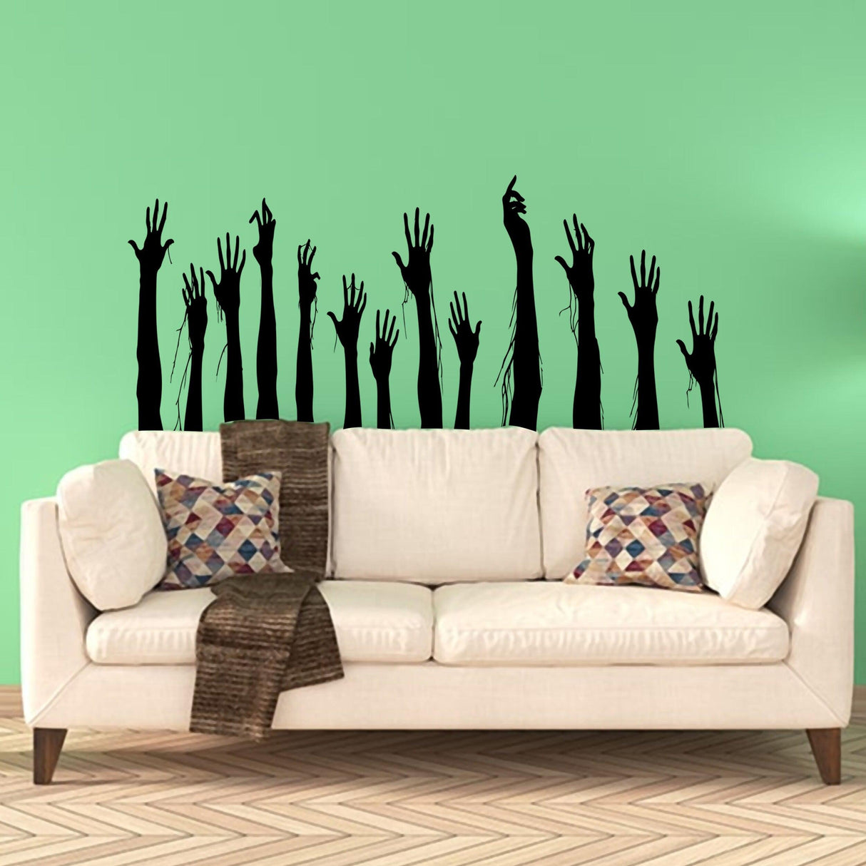 Funny Halloween wall decals featuring creepy zombie hands rising above a sofa in a stylish living room.