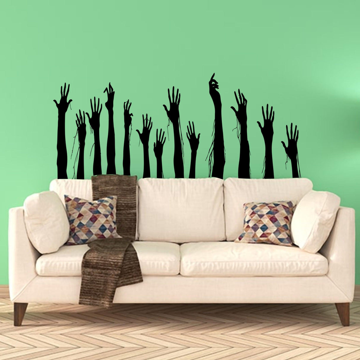 Zombie hands wall decal design above a sofa, perfect for Halloween decor and spooky themes.