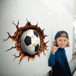 3D football wall decal bursting through wall with a smiling boy in a cap, perfect for kids' sports-themed room.