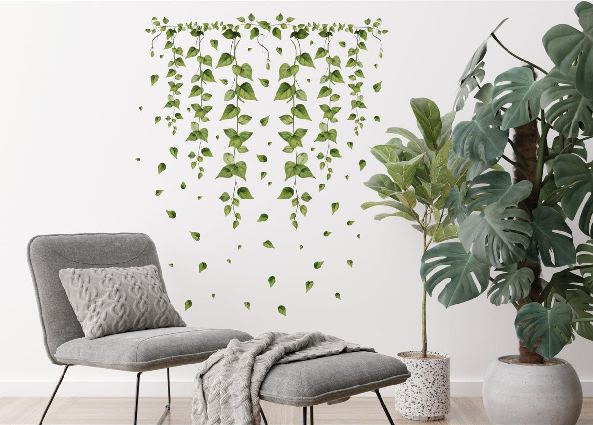 Hanging vine wall sticker featuring green ivy leaves, enhancing modern living room decor with nature-inspired design.