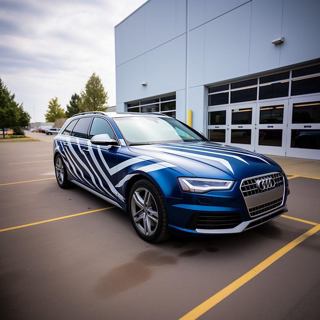 Stylish blue Audi car featuring geometric white vinyl stickers for a modern look on the side.