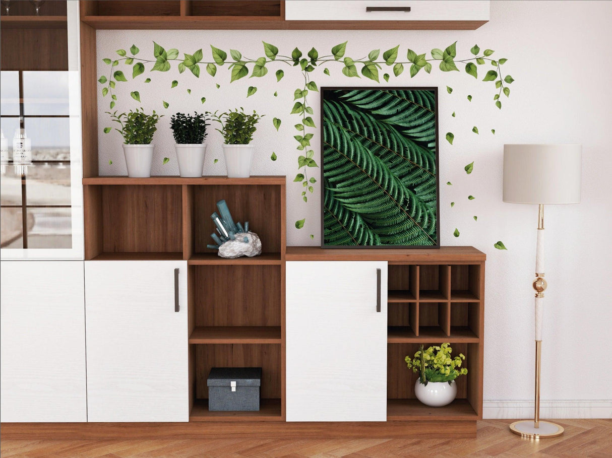 Hanging vine wall sticker with green ivy leaves decor in a stylish living room setup.