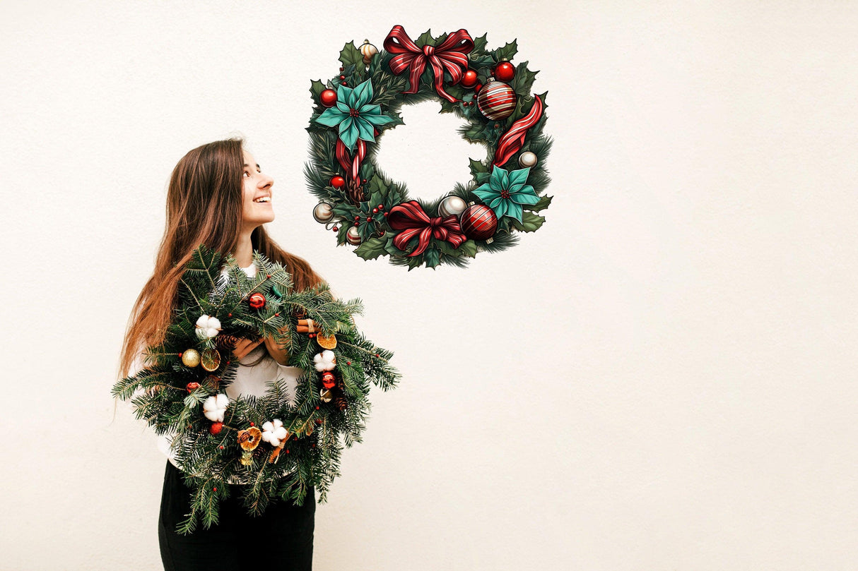 Woman holding a festive Christmas wreath with a wall decal of a wreath above, showcasing holiday elegance.
