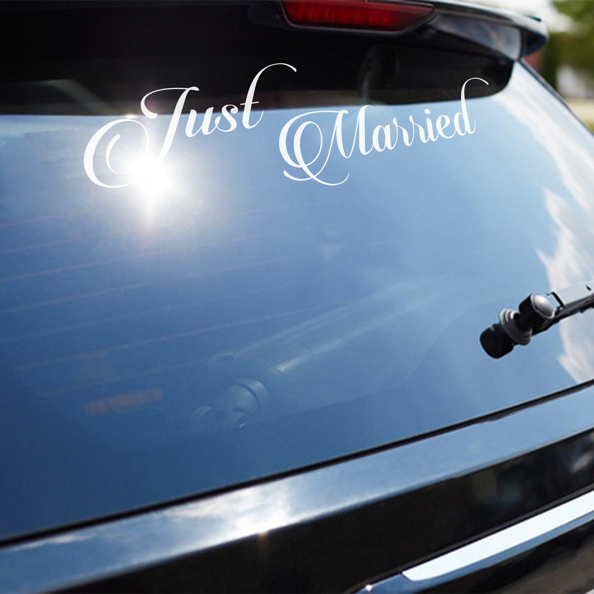Just Married vinyl decal on a car window, perfect for celebrating weddings and new beginnings.