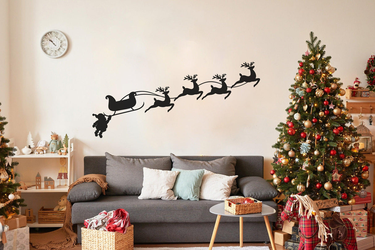 Funny Santa sleigh with reindeer wall decal in festive room with Christmas trees and cozy decor.