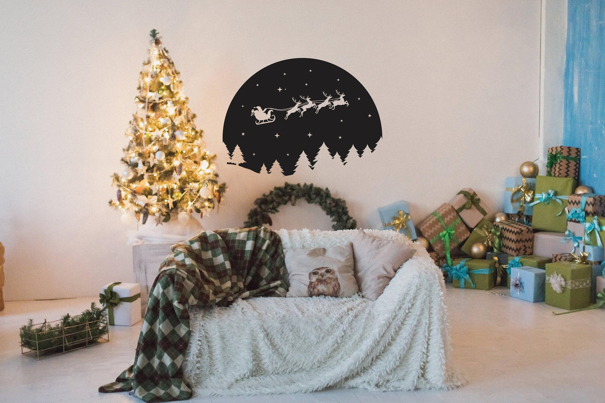 Starry Sky Santa and Sleigh with Deers wall decal above a cozy couch and Christmas tree.