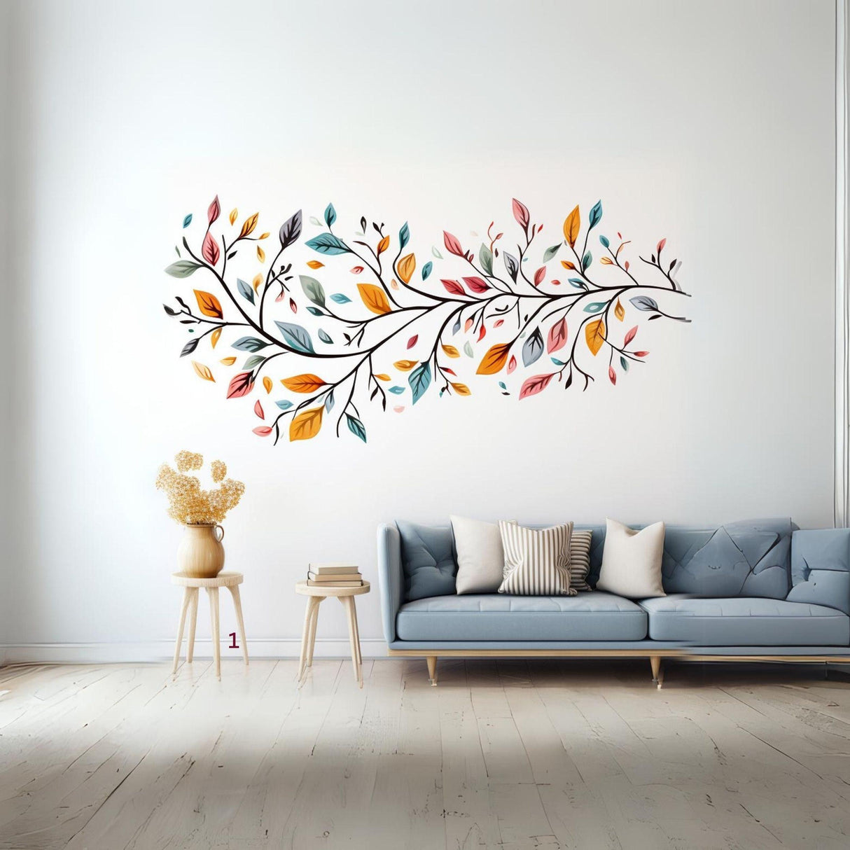 Stylized tree wall sticker with colorful leaves above a modern sofa in a bright room decor.
