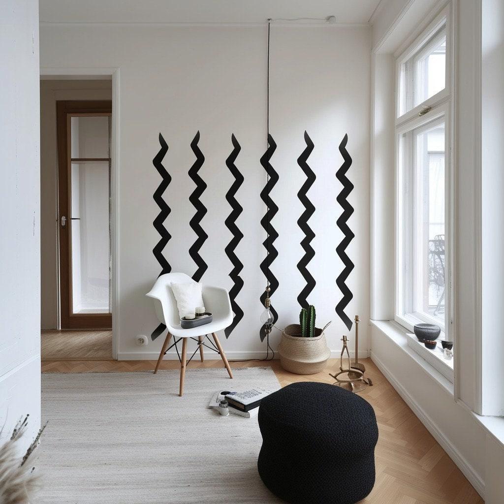 Modern black zigzag wall stickers in a contemporary living room with white walls and stylish furniture.