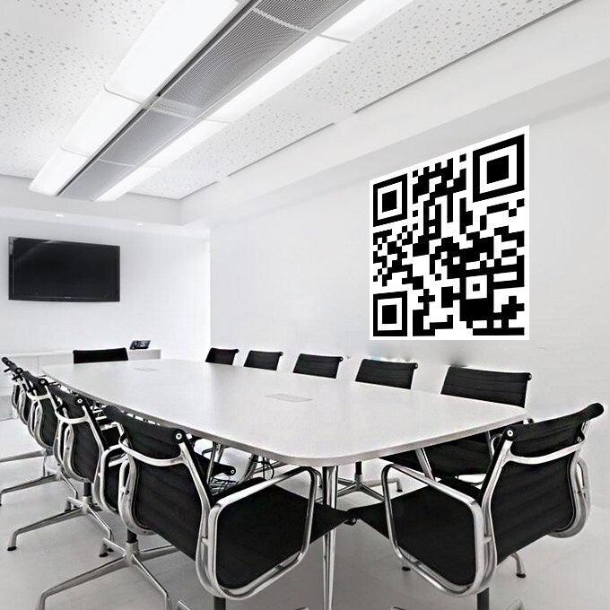 Custom QR code sticker displayed on a wall in a modern conference room, showcasing durable and waterproof design.