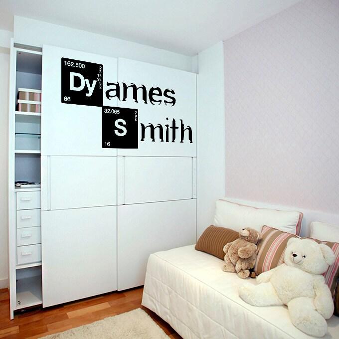 Custom vinyl sticker decal displaying the name 'James Smith' on a bedroom wall, adding a personal touch to the decor.