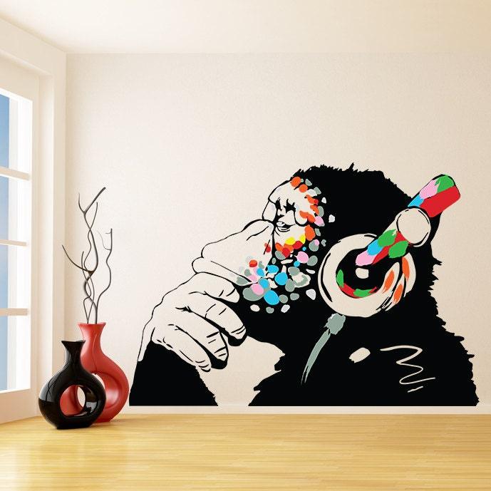 Banksy monkey graffiti wall decal with colorful headphones, adding urban art to modern home decor.