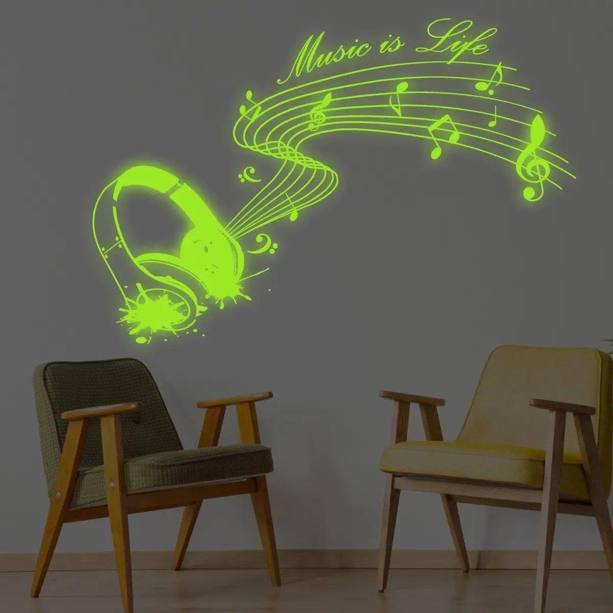 Glow-in-the-dark wall decal featuring musical notes and headphones that says 'Music is Life' in neon green.
