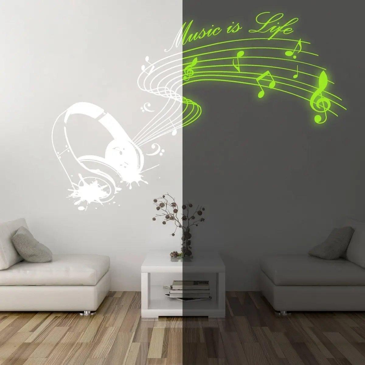 IllumiNote Glow-In-The-Dark wall decal featuring musical notes and headphones, illuminating a stylish living room.