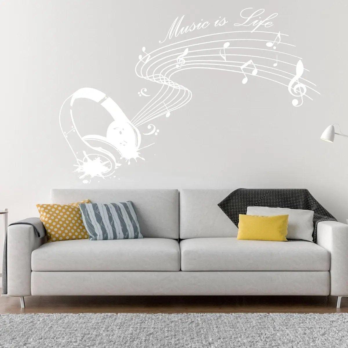 Glow-in-the-dark wall decal with musical notes and headphones, enhancing a cozy living room space.