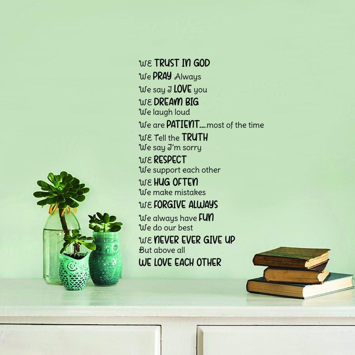 Inspirational family quote wall decal on green wall with plants and books, promoting love and faith.